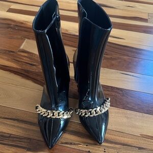 RAYE Glossy Black Heeled Boots with Gold Chain Accent